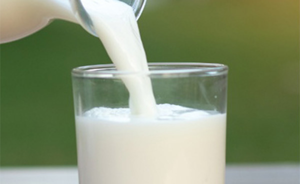 Pouring milk into a glass