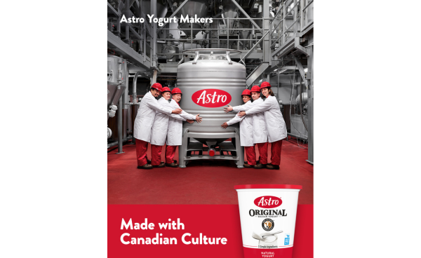 Lactalis Canada employee holding an Astro yogourt filled tank